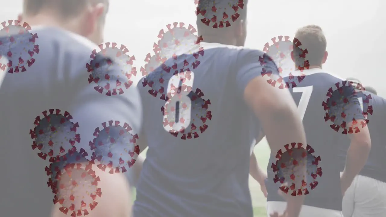 Animation of digital interface with covid 19 virus cell over rugby players