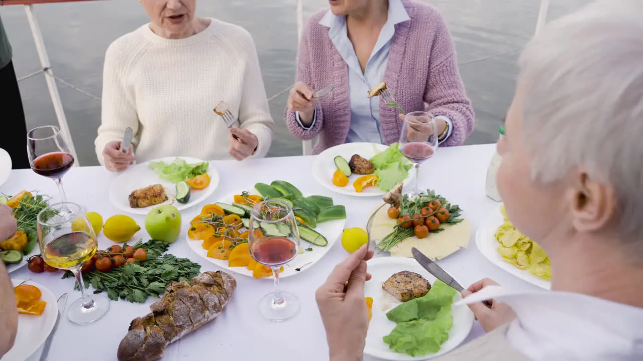 A Group Of Senior Friends Having Dinner Together 1