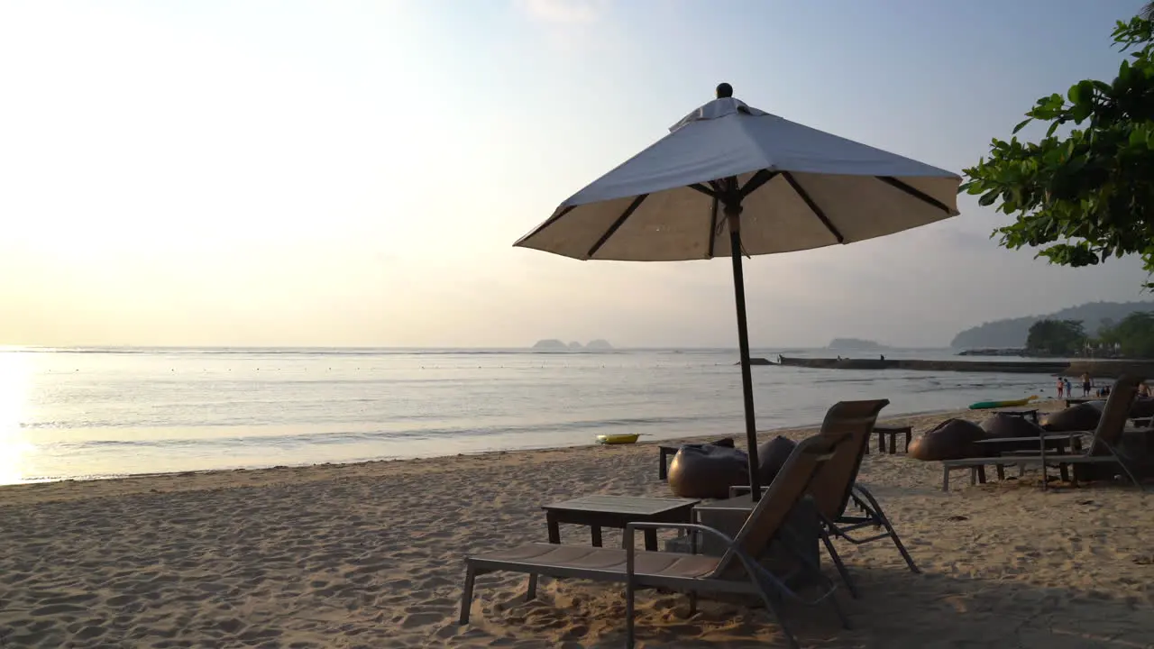 Sunset with umbrella deck chair pool