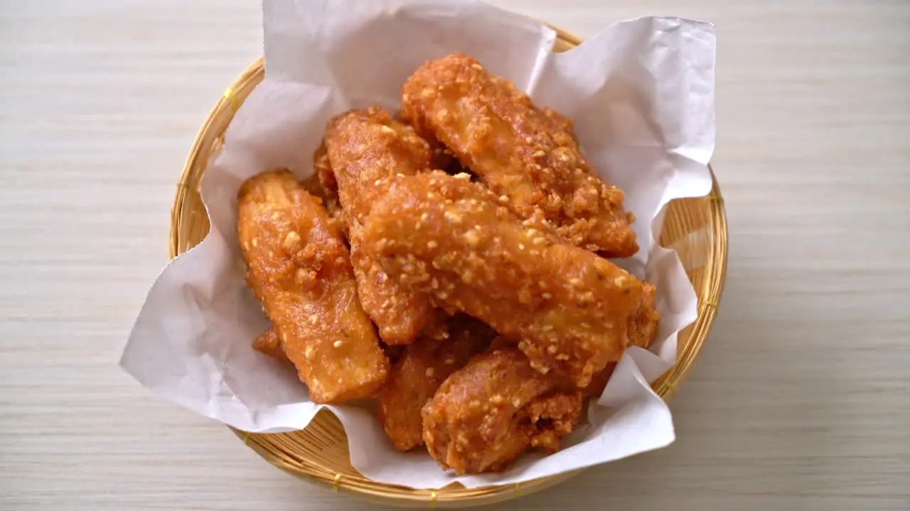 deep fried sliced potatoes stick with sesame Thai food style