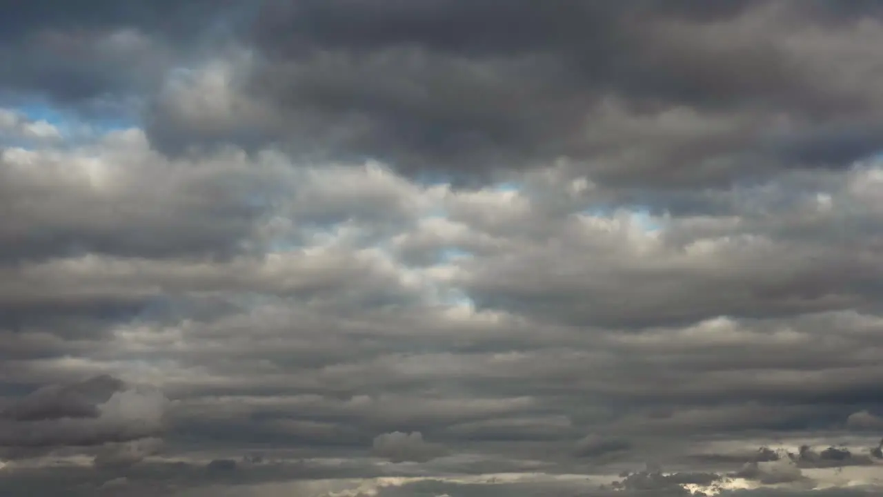 A time-lapse shot of clouds moving into the sunset