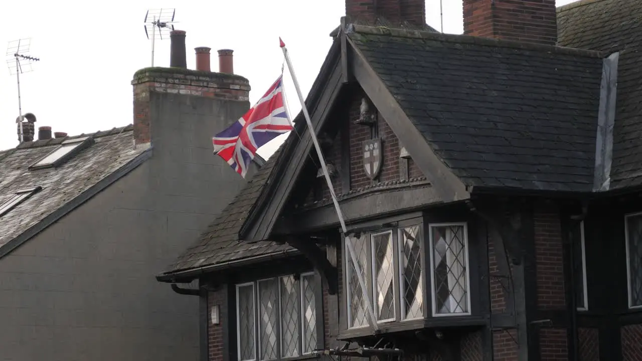 British flag on old house slow motion