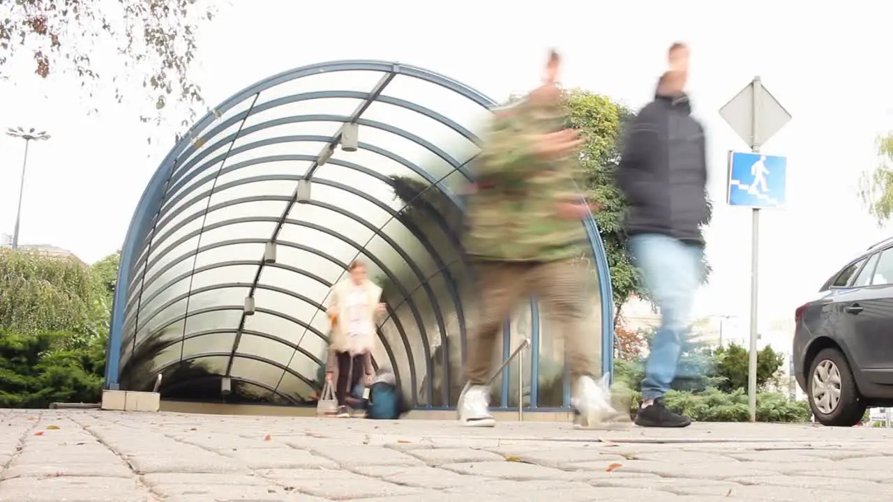 A Time-lapse of People Walking In and Out of a Bydgoszcz Subway Entrance in Poland on a cloudy day