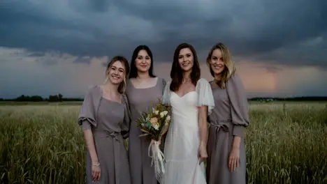 Bride posing with her bridesmaids