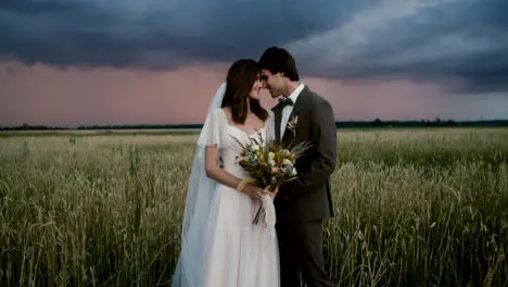 Young couple in love in a fall field