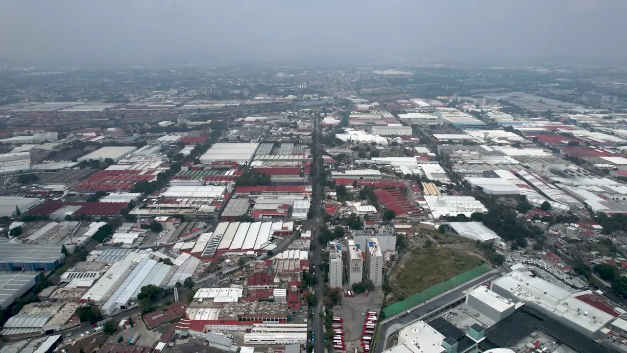 frontal drone sho of mexico city industrial zone in a cloudy day