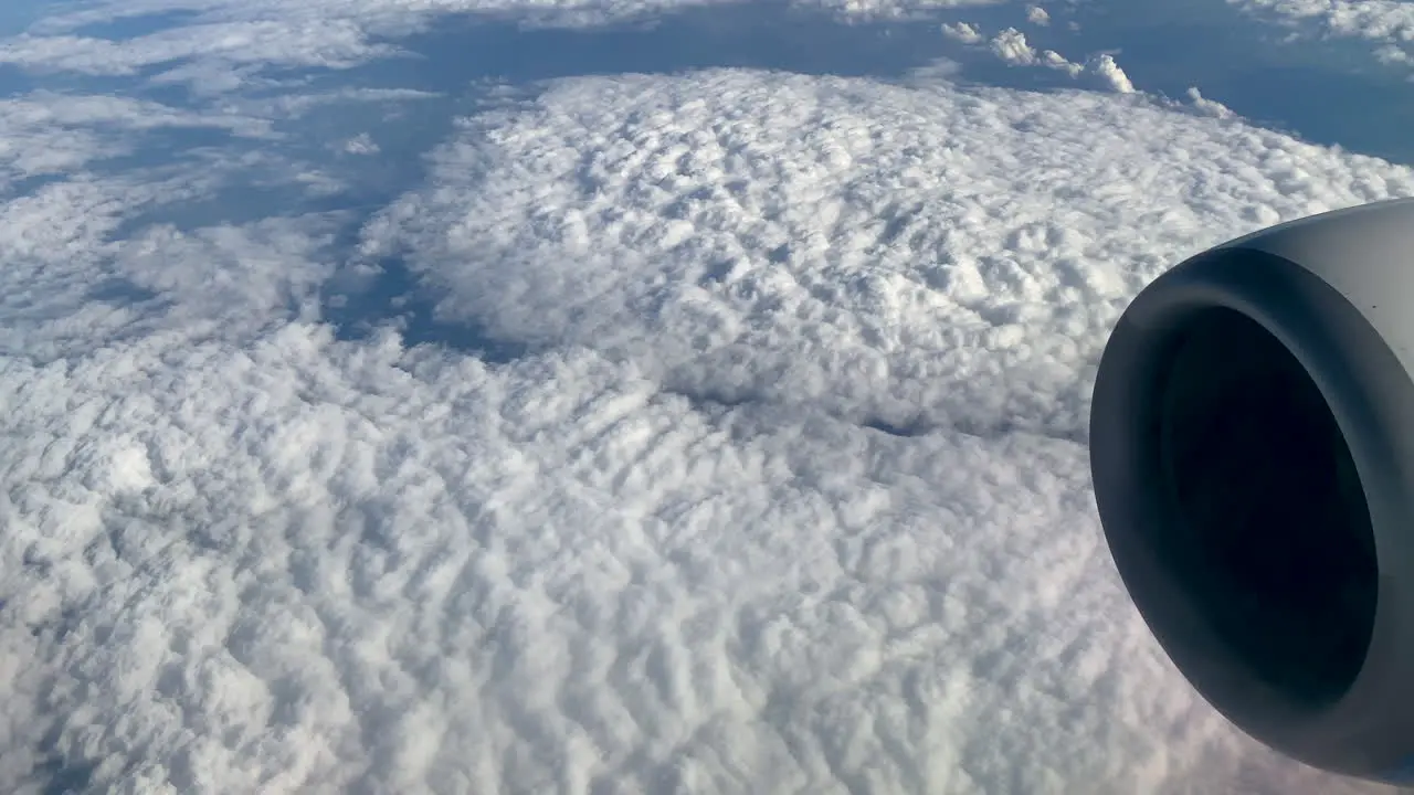 Thick Carpet Of Fluffy Stratus Clouds Seen From Window Airplane On Flight