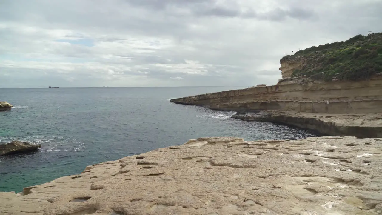 Mediterranean Sea Washing Shores of St Peter’s Pool Stone Beach in Winter