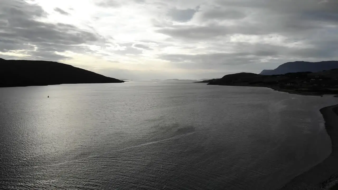 Aerial backwards shot of Loch Broom at Ullapool in the Scottish Highlands