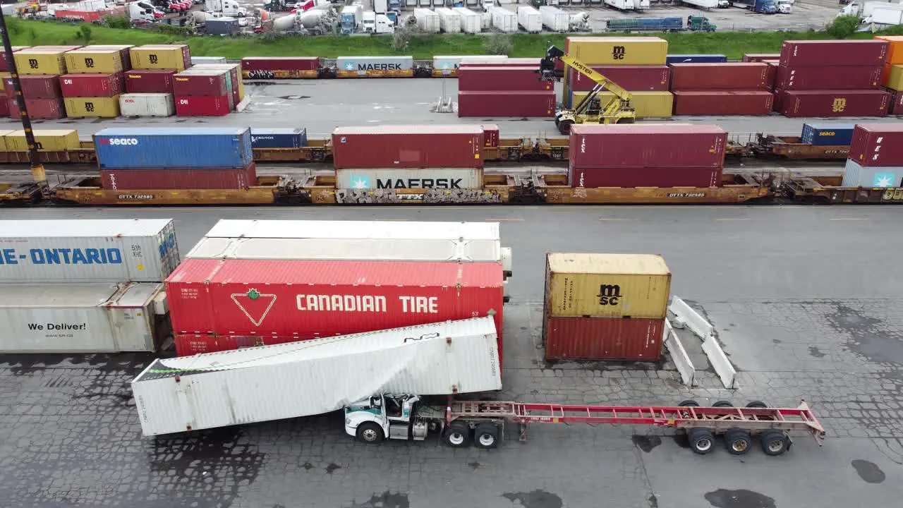 Cargo Container Razed By Strong Wind Storm Toppled Down Over Truck At The Freight Yard Of An Intermodal Terminal In Brampton Ontario Canada