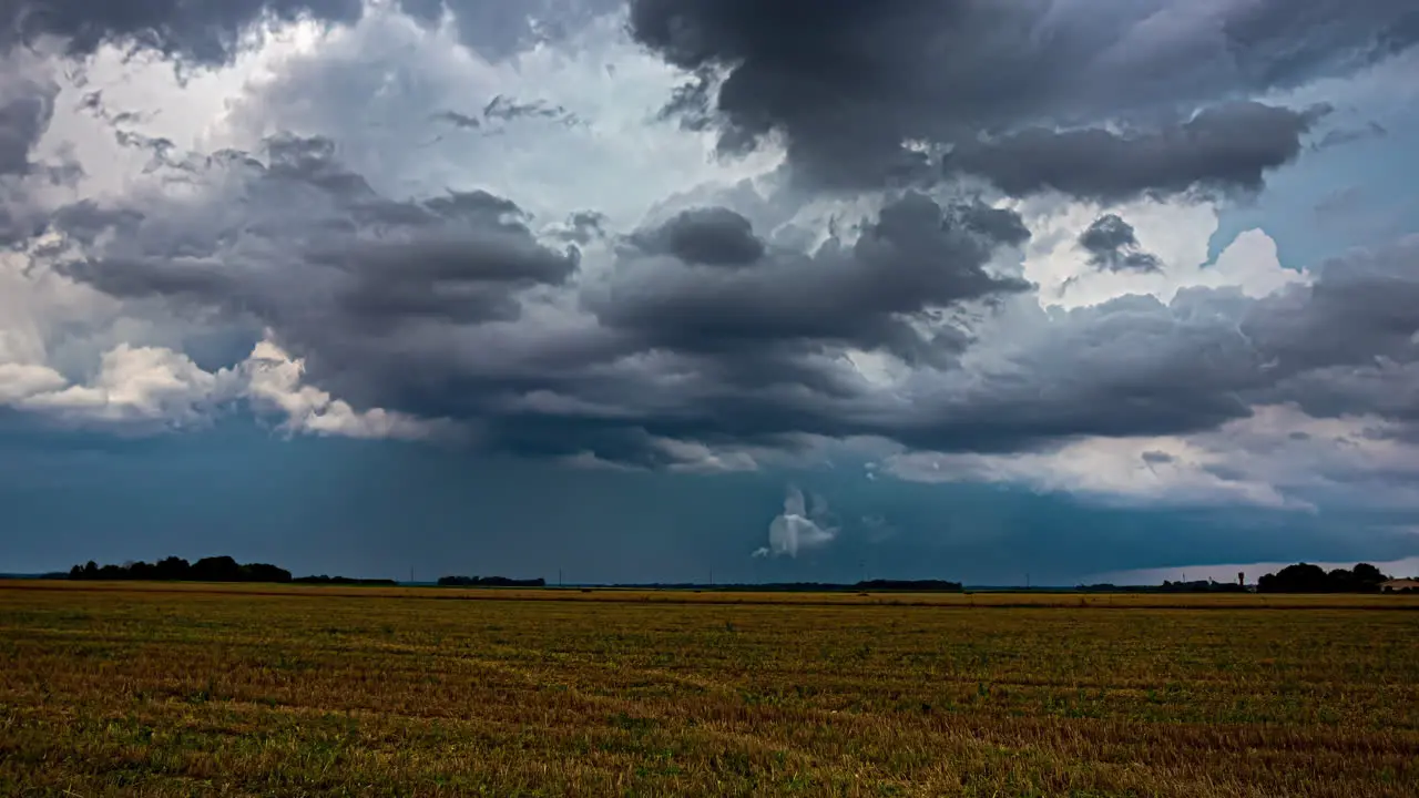 Timelapse Reveals Spectacular Cloud Formation Over Farmland as Tractors Plough the Fields