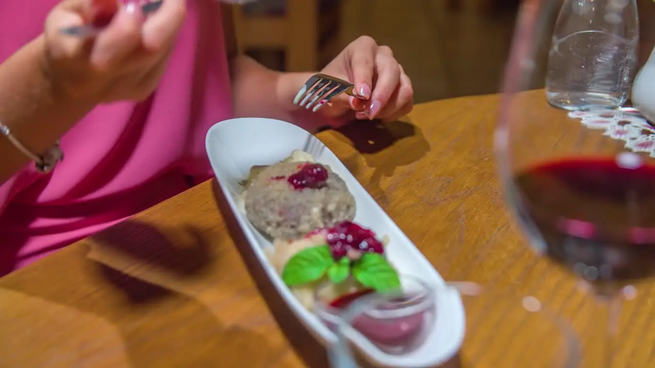 Close up dessert at restaurant Caucasian female hands putting dessert on spoon Static shot