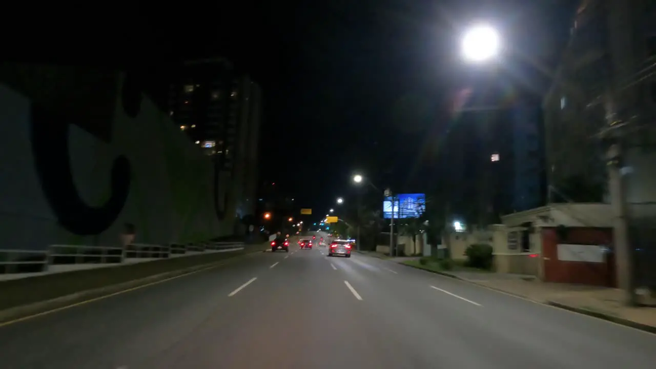 Car traffic at night on an urban avenue hyperlapse video