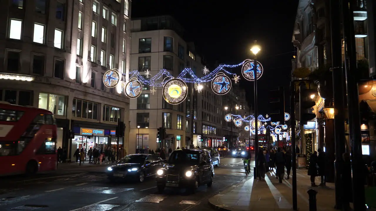 Strand London Nighttime Cityscape Buses and Taxis Christmas Season