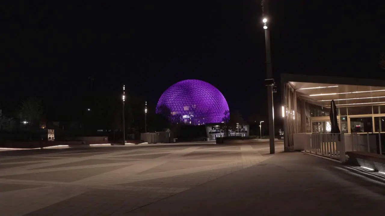 A Wide Shot of Parc Jean Drapeau with the Biosphere Lit Up Purple at Night in Montreal Quebec