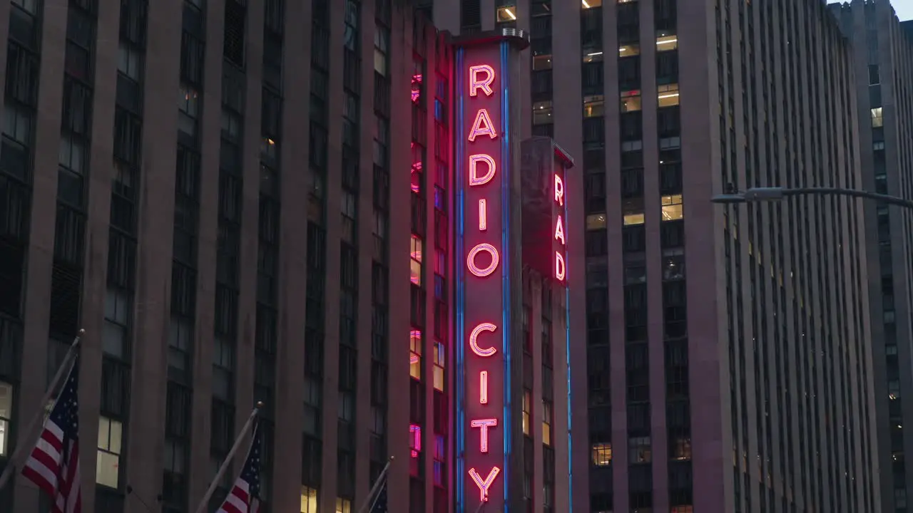 Radio City Music hall neon sign side view of neon lights night time city glow