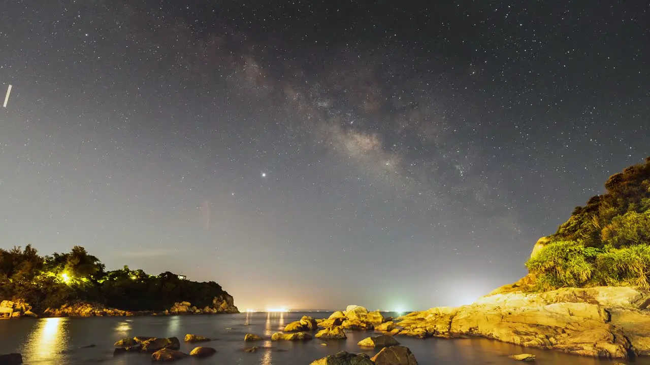 Cheung Chau glowing beach wilderness beneath illuminated milky way night sky shooting stars Hong Kong