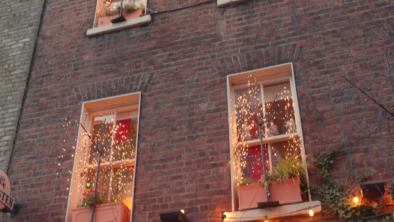 Handheld establisher windows of the Ginger Man christmas decorated Pub