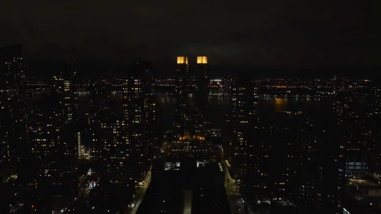 Aerial view rising towards the illuminated the Rushmore condo in Upper West Side NY