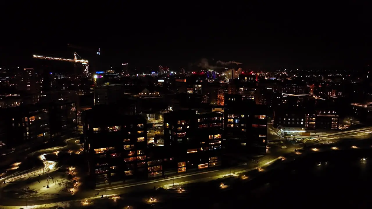 Aerial view around modern condos on the coast of Tampere winter night in Finland