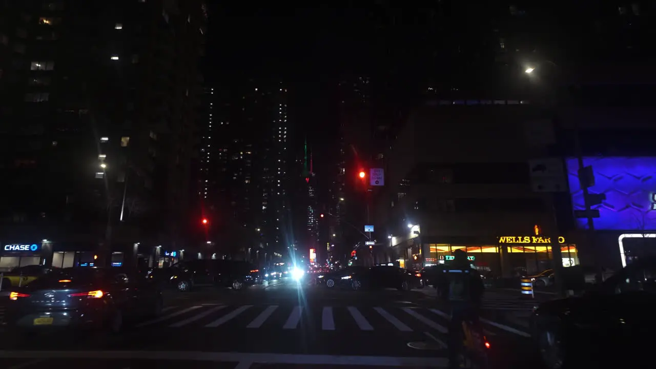 Point of view shot driving on the night lit streets of Manhattan night in New York