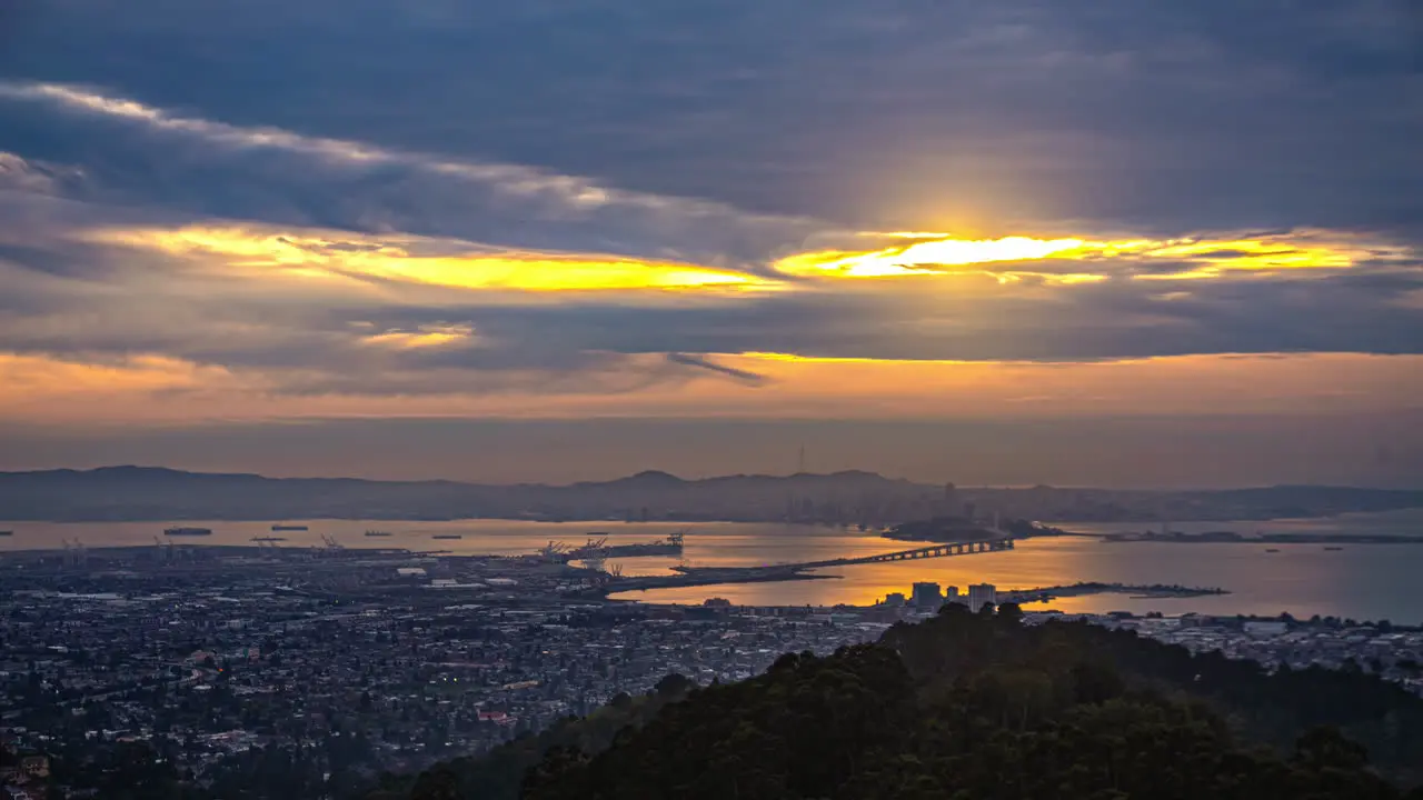 San Francisco Bay as seen from Oakland California sunset twilight to nighttime time lapse colorful cloudscape