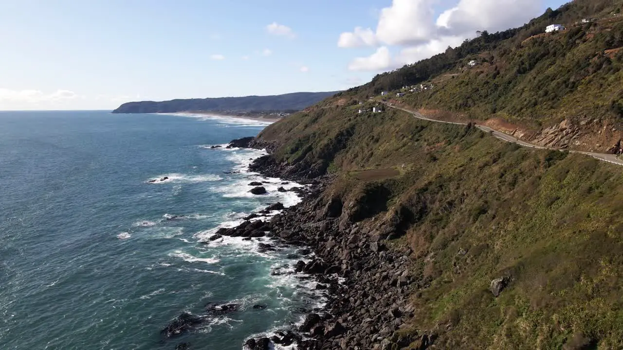 Aerial push out view of cliffside in the coastline of Chile