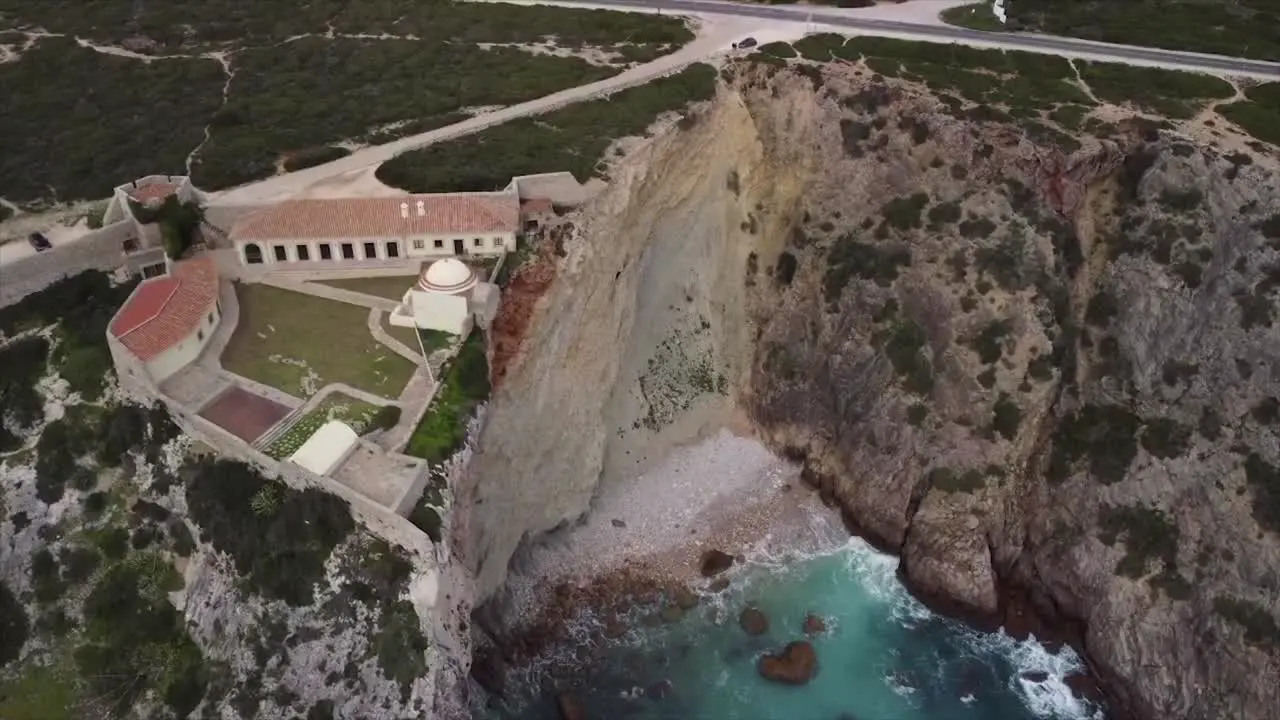 Flying over the beautiful turquoise foamy waves of the magnificent ocean and the Fortress of Belixe