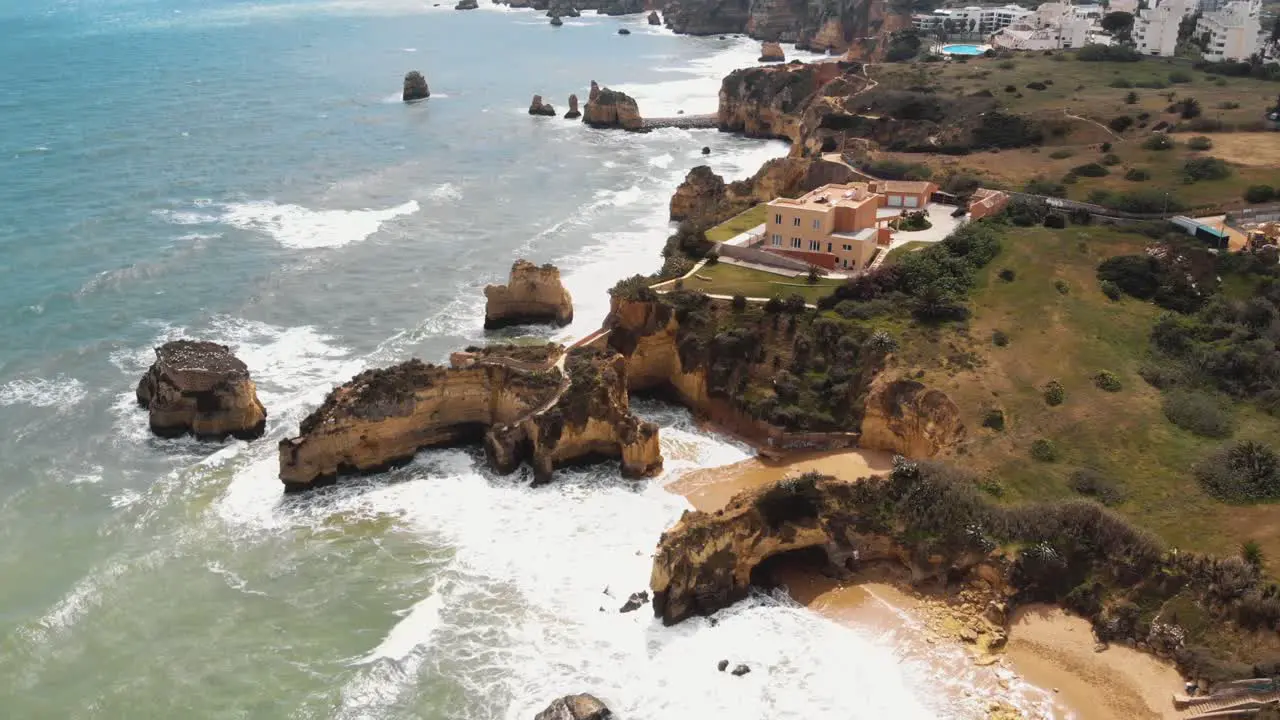 Rocky coastline Praia dos Estudantes beach Lagos Algarve