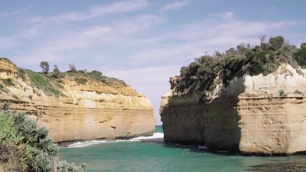 Waves lapping against Loch and Gorge Rock Formation along Great Ocean Road Victoria Australia