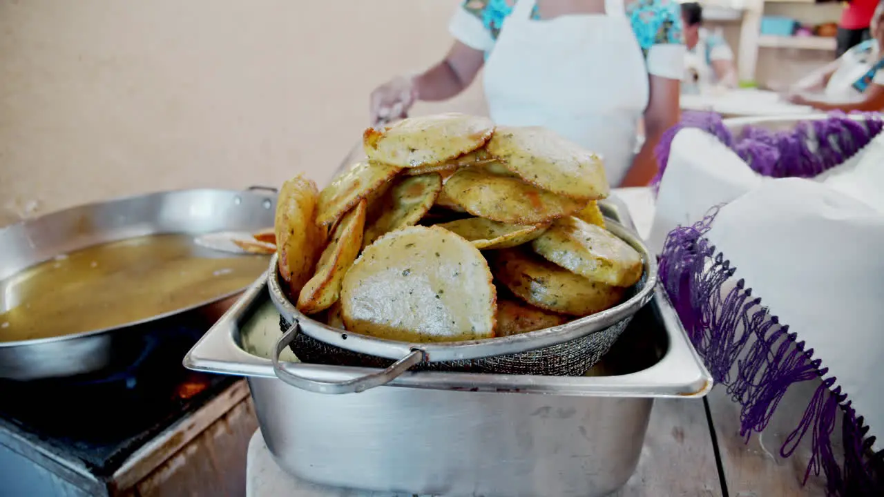 Slow motion close shot of tortillias being prepared in the back of the kitchen Quintana Roo Mexico