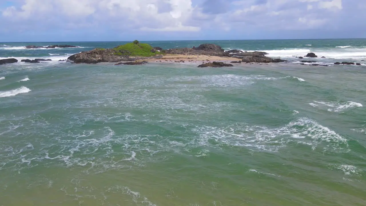 Headland And Rocky Outcrops With Scenery Of Foamy Waves Splashing At Sawtell Beach In New South Wales Australia