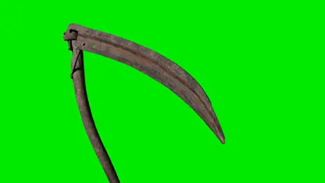 Ancient rusted metal scythe on green chromakey background