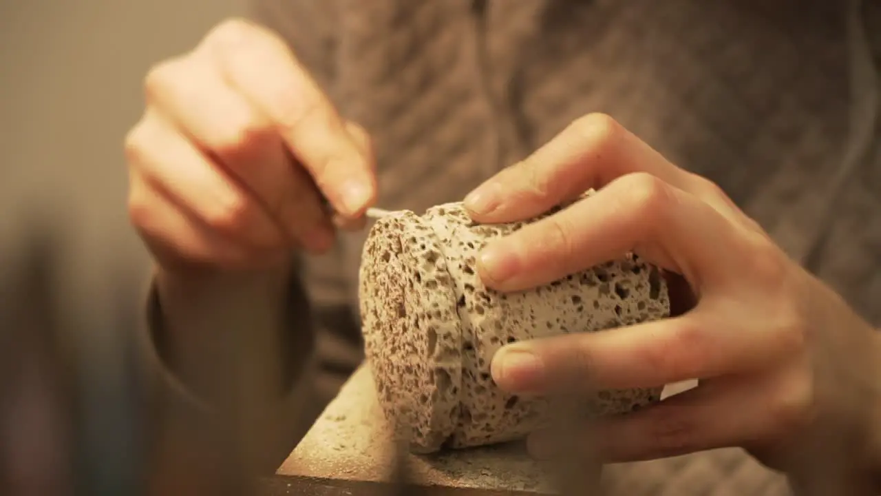 Cleaning filing of cylinder from concrete closeup shot in slow motion