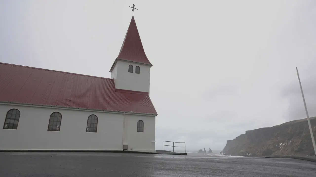 Vík í Mýrdal Village Church on Hill Above Coastline of Iceland on Cloudy Day