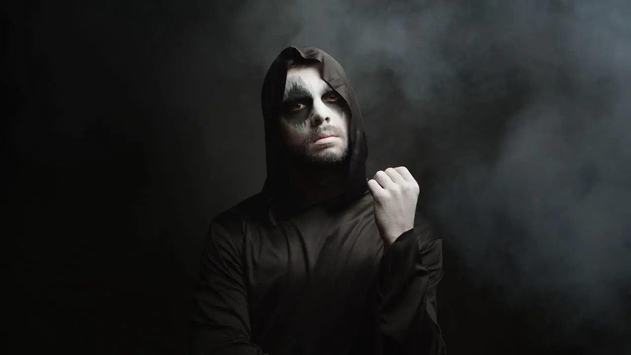 Man dressed up like grim reaper for halloween party