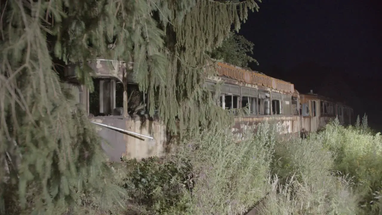 Old rotten tram in night forest horror location