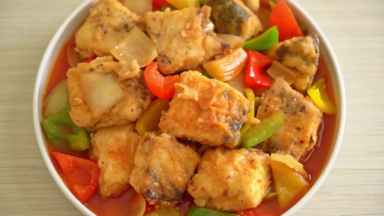 Fish stew with tomato and pepper on plate