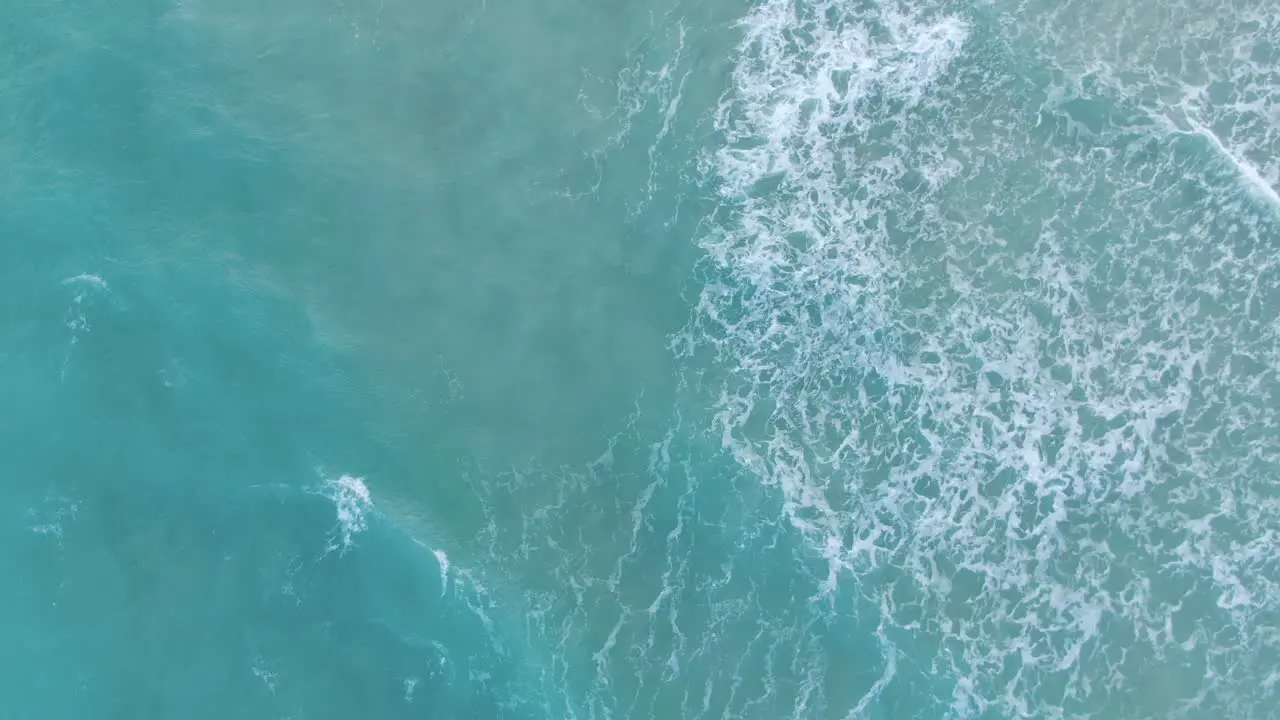 Turquoise Blue Waves In Slow Motion At Miami Beach In Florida With Mid-Beach Neighborhood Revealed