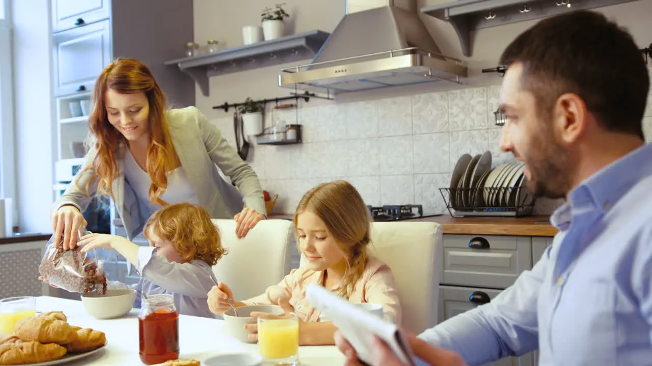 Family Having Brakfast Together In The Kitchen