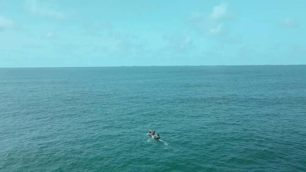 Victoria Island Lagos Nigeria 20 November 2022 Drone view of a fisherman on a fishing boat on the coastline of Lagos