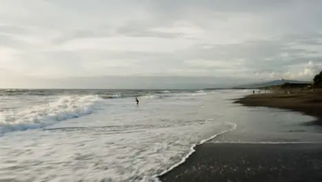 Drone Shot Flying Over Waves Crashing at Pigstone Beach