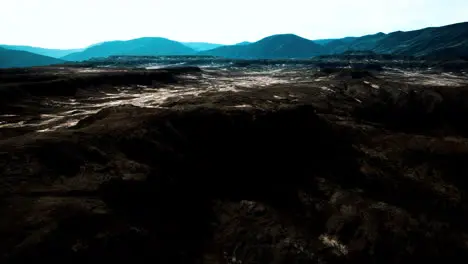 black volcanic basalt rock formations in the low light