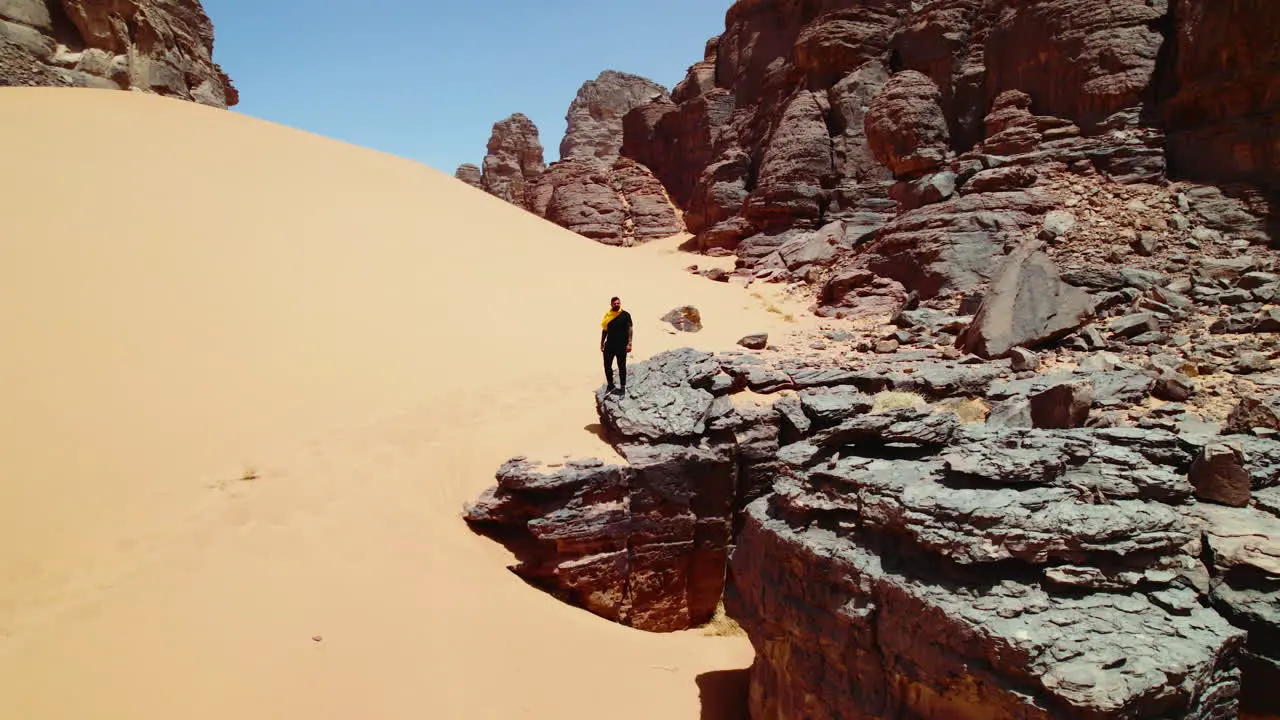 Aerial View Of Man Standing On The Rock Formation In Djanet Desert Algeria