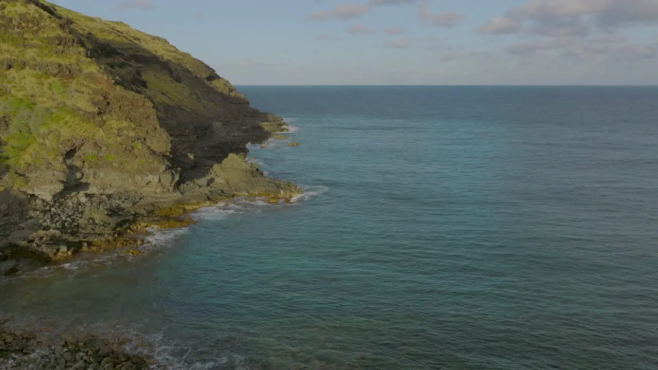 Aerial of Pacific Ocean meeting the shore in Oahu Hawaii at Sandy Beach park