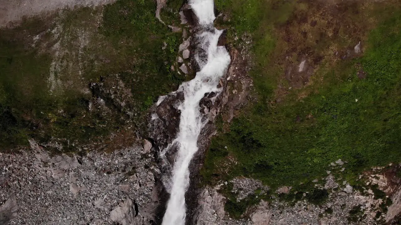 Bird's Eye View Of Waterfall Flowing By The Cliff In Austria