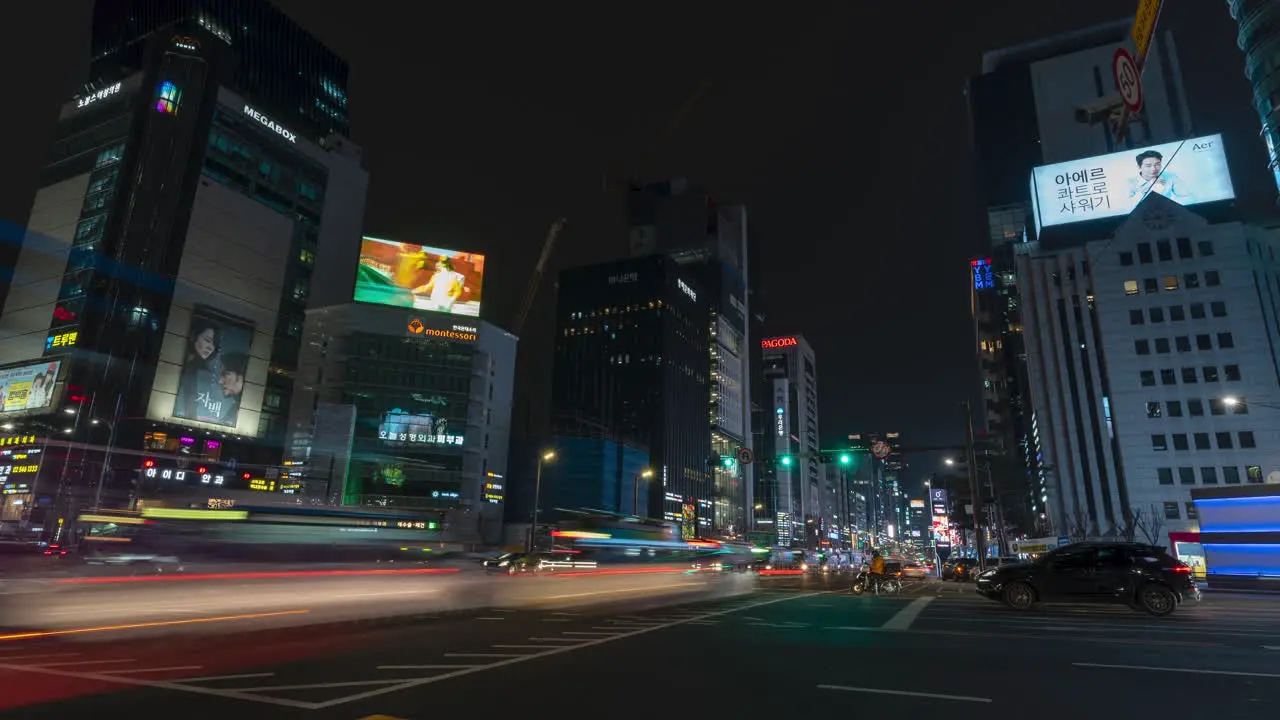 Gangnam boulevard crossroads busy night traffic timelapse Seoul South Korea zoom in