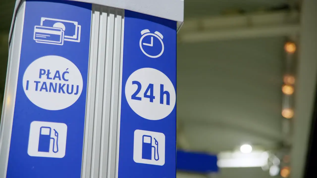 Non-stop service sign located on a petrol station at night