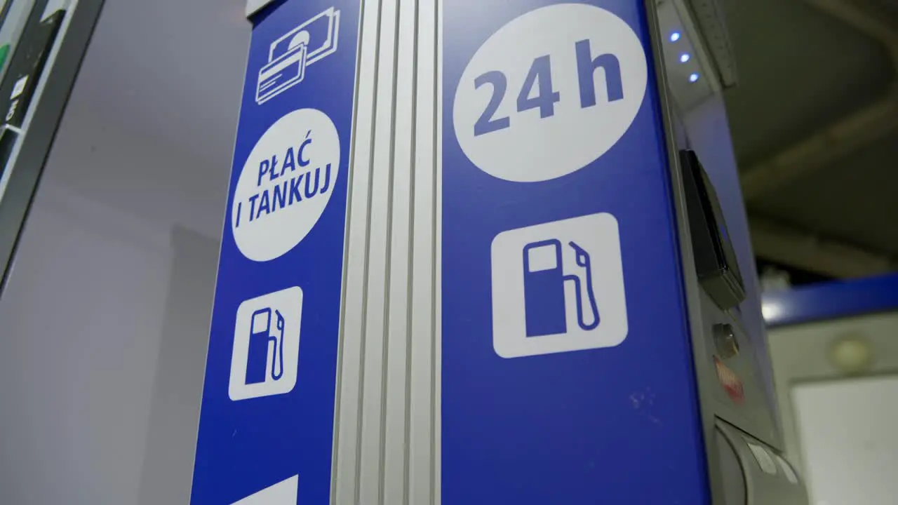 24-7 service sign located on a petrol station at night