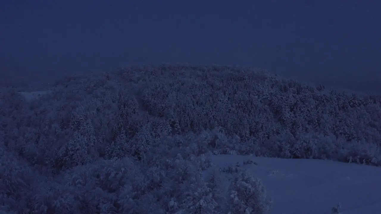 Beautiful snowy hill at night